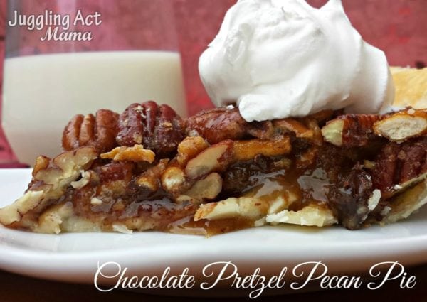 Slice of Chocolate Pretzel Pecan Pie with whipped cream.