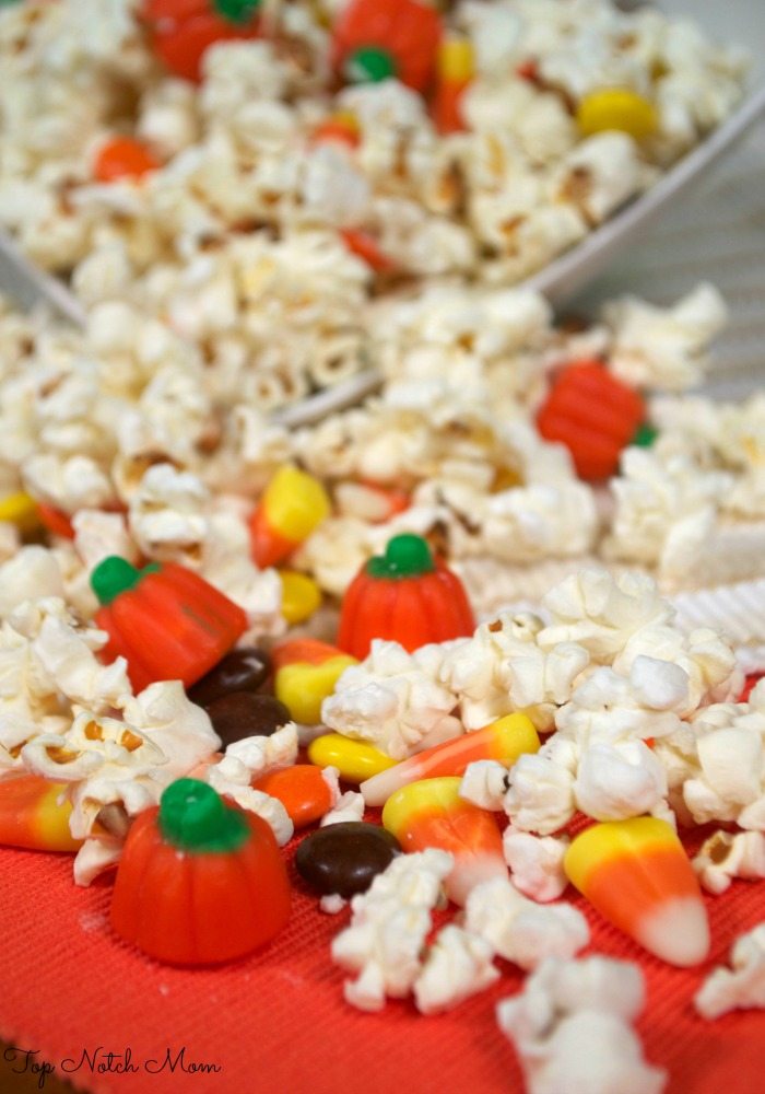 White Chocolate Halloween Popcorn Mix spread on a placemat.
