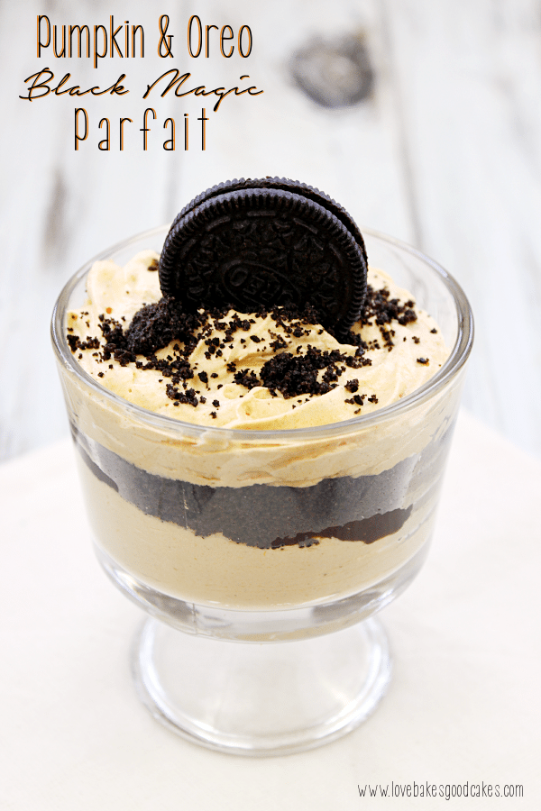 OREO pumpkin cheesecake parfait in a parfait glass, topped with a whole OREO cookie.