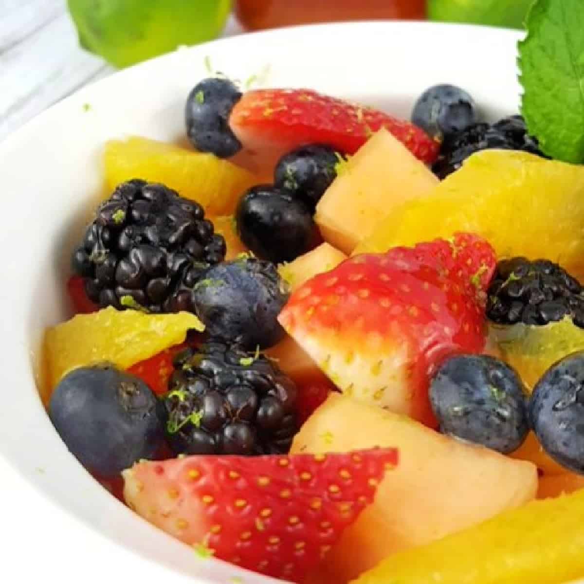 Close up of a bowl of Honey Lime Fruit Salad.