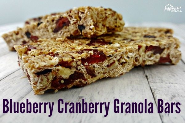 Close up of Blueberry Cranberry Granola Bars on a white table.