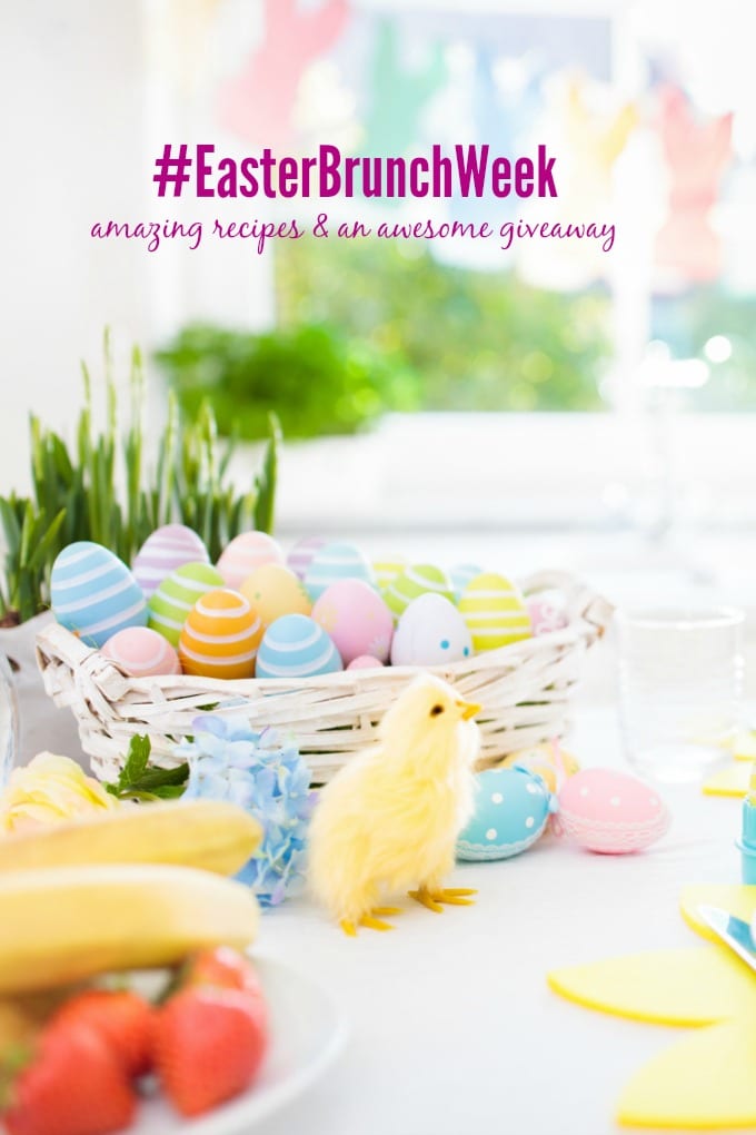 Easter breakfast table setting. Decoration for Easter family celebration. Eggs basket and spring flowers. Bread, croissant and fruit for kids meal. Egg and pastel bunny decor in kitchen at window.