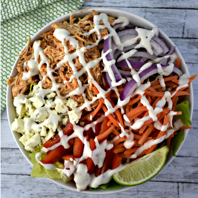 Close up of loaded salad with buffalo chicken.