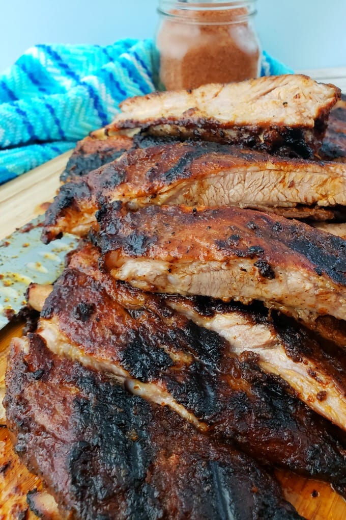 The Best Way to Grill Ribs is low and slow! This easy 5-ingredient recipe comes together quickly for tender delicious St. Louis style ribs that are perfect! #ad #smithfield via @jugglingactmama