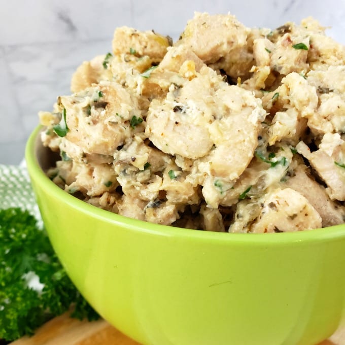 Cooked and seasoned chicken in a bowl.