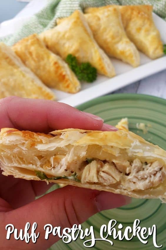 Puff pastry stuffed with a creamy chicken mixture of onions, garlic, and creamy Swiss cheese makes an impressive dinner and it is perfect for parties, too. via @jugglingactmama