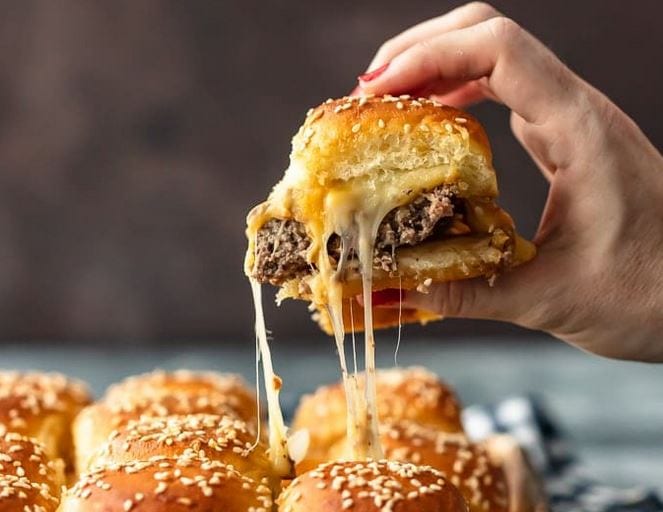 hand holding a Baked Cheeseburger Sliders 