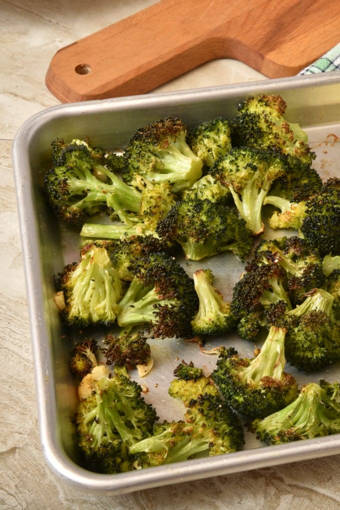 Oven-roasted broccoli with parmesan cheese is super delicious and so easy. We'll teach you How to Roast Broccoli in the Oven. via @jugglingactmama