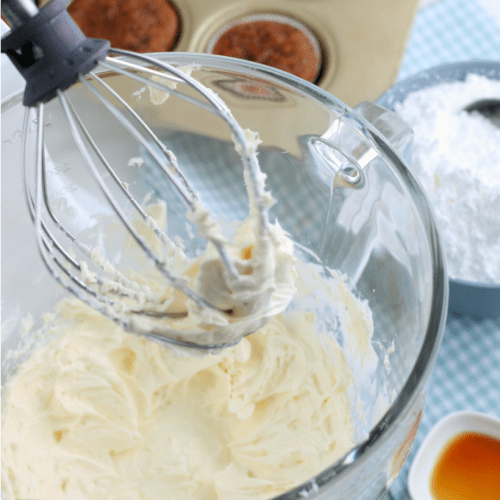 close up of mixer with cream cheese frosting