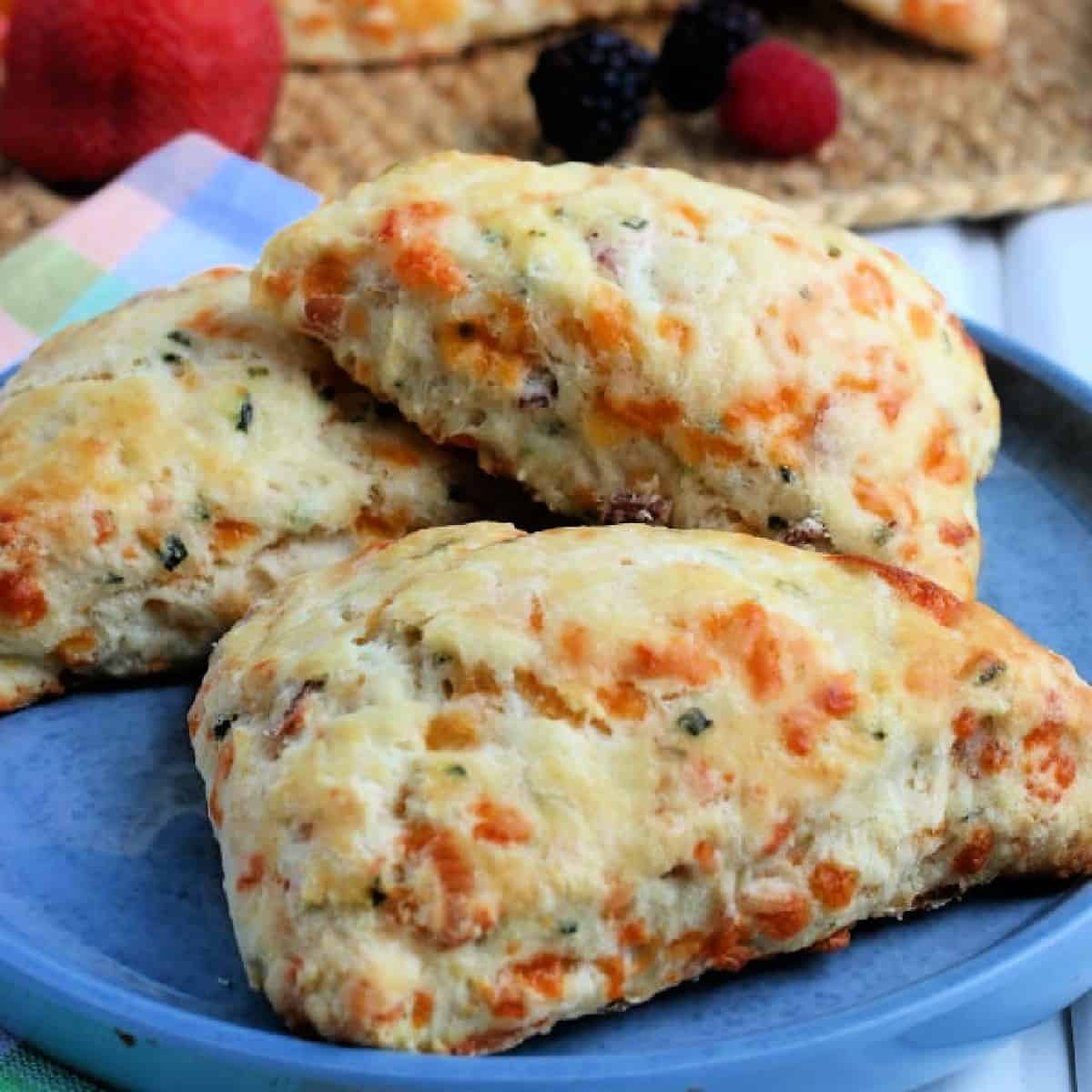 Bacon and Cheddar Scones on a blue plate.