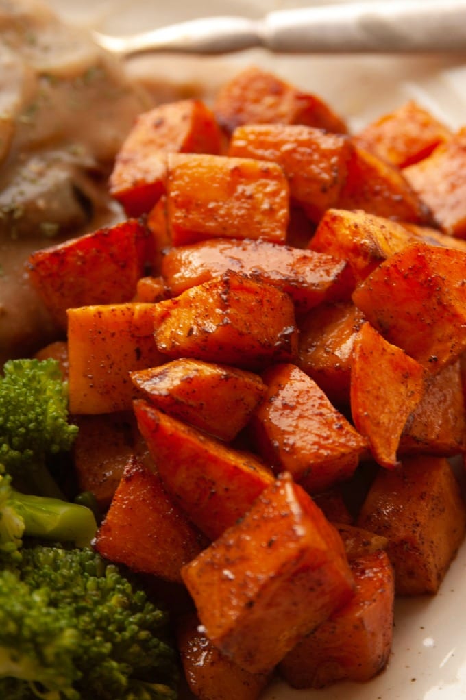 Maple roasted sweet potatoes are a delicious and simple side that's perfect for Thanksgiving or any Fall evening meal. via @jugglingactmama