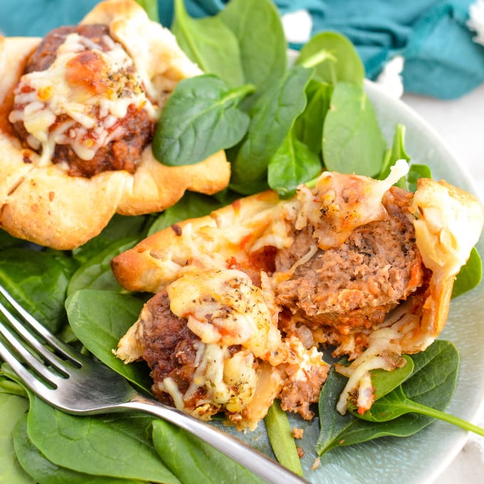 Meatball Cupcakes on a bed of spinach.