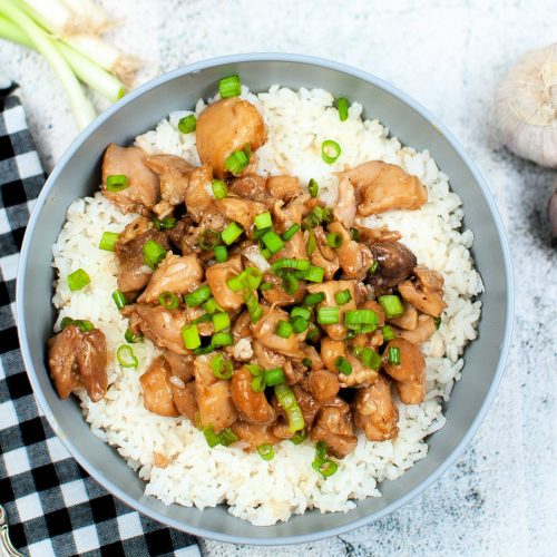Top down image of instant pot bourbon chicken in a gray bowl.