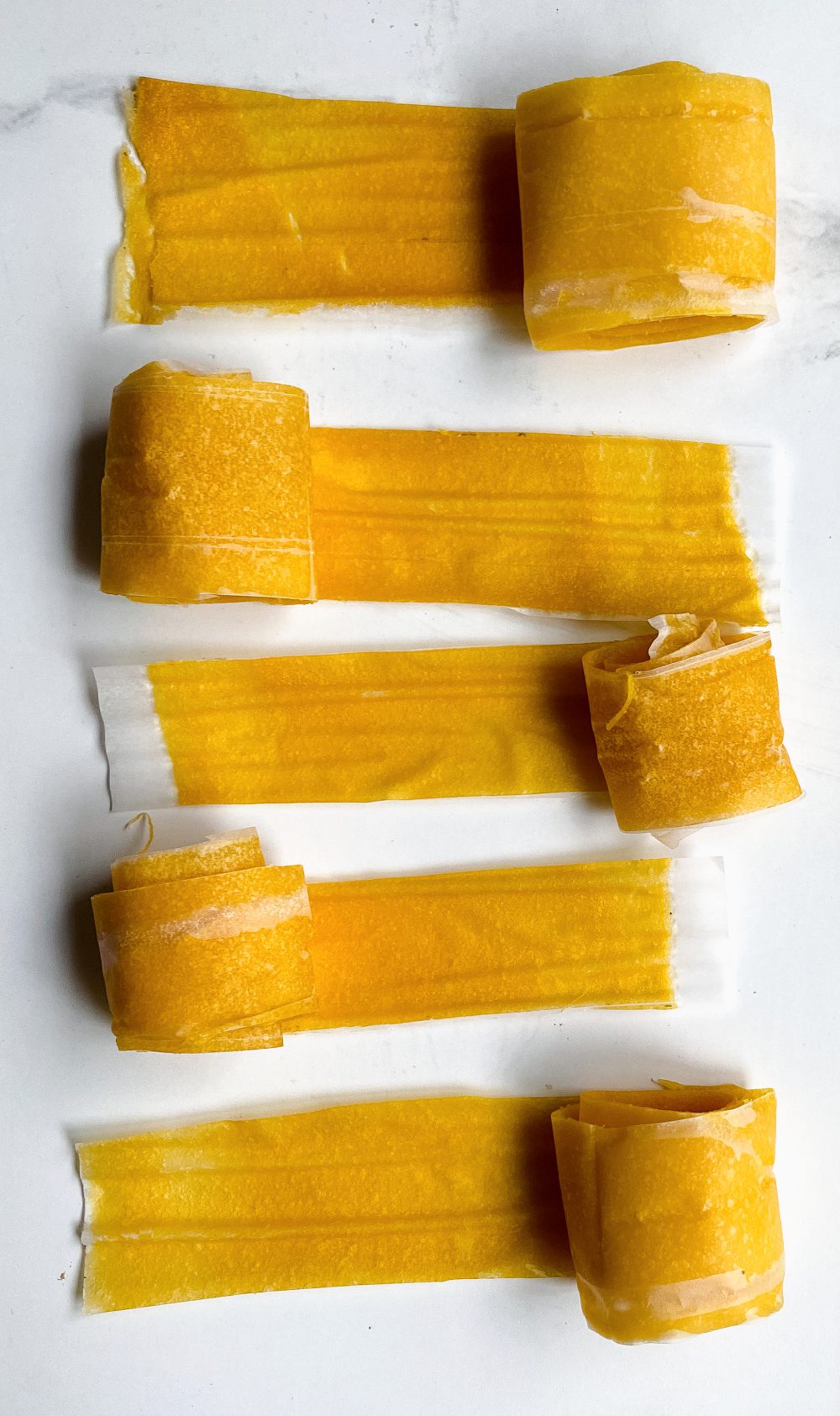 Make your own homemade mango fruit leather with just 3 simple ingredients. Your kids will love the taste, and you'll love knowing just what they're eating! via @jugglingactmama