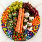 Square image of Halloween candies and snacks on a Halloween Charcuterie Board.
