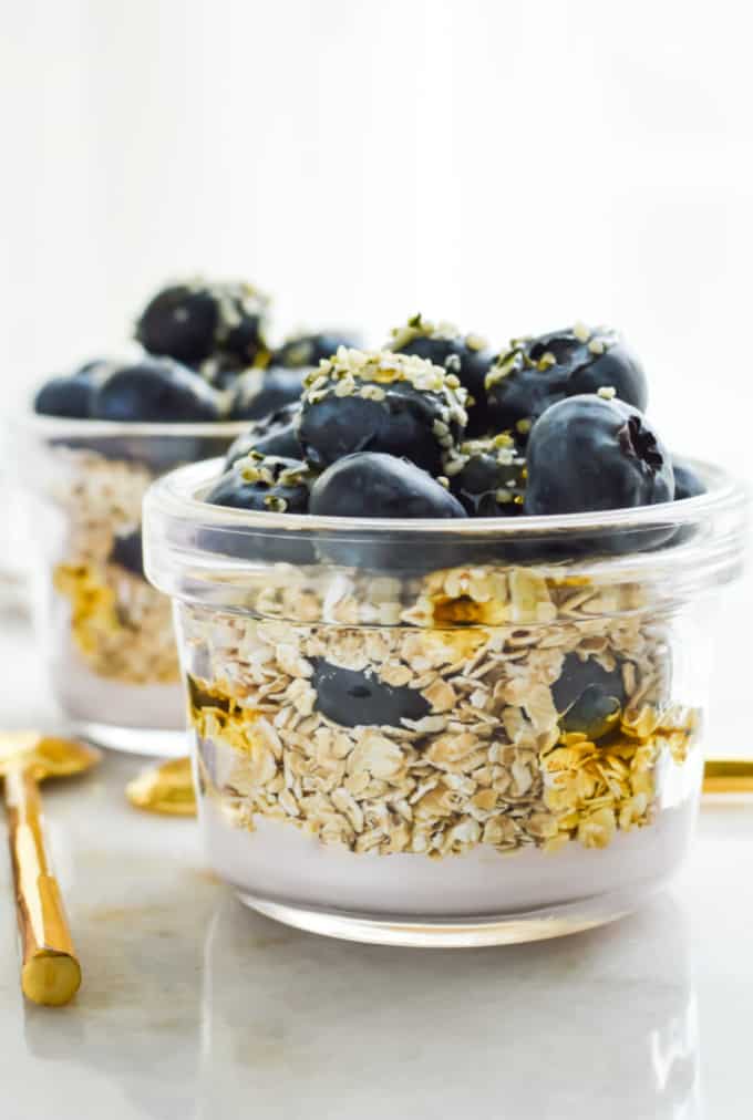 Blueberry overnight oats in glass jars.