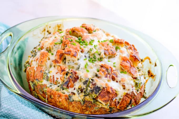 Close up image of spinach and artichoke pull apart bread. 