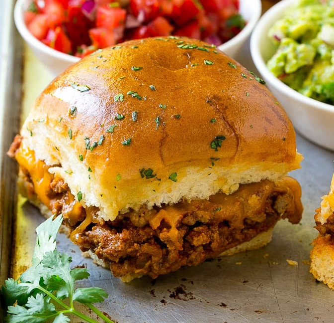 close up of taco sliders on the edge of a sheet pan