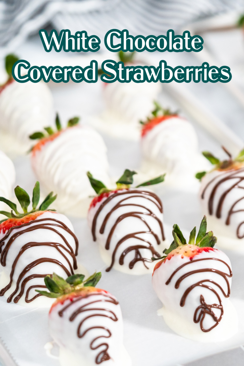 Learn to make your own homemade White Chocolate Covered Strawberries with this easy tutorial. Drizzled with white or milk chocolate, they make a delicious gift or bite-sized dessert any time of year! via @jugglingactmama