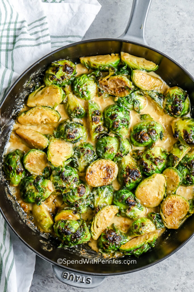 Top down image of brussels sprouts in a cast iron skillet.