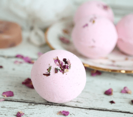 Close up of DIY Rose Bath Bombs with rose petals.