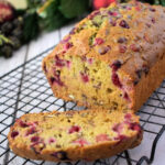 Close up of Cranberry Orange Bread on a cooling rack.