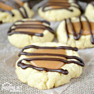 Close up of Homemade Twix Cookies on parchment paper.