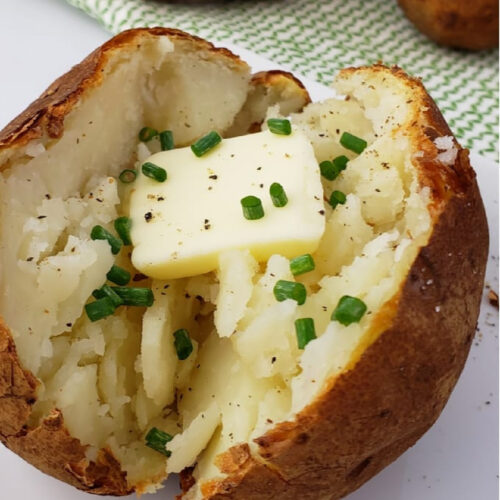 Close up of Air Fryer Baked Potato with butter.