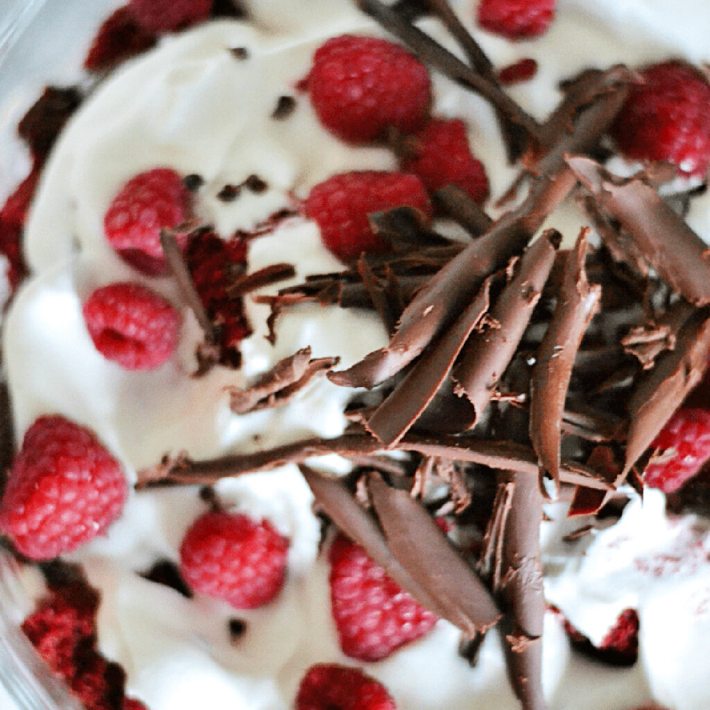 Top down view of Red Velvet Raspberry Trifle with chocolate shavings.