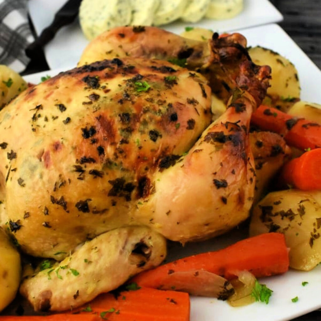 Roasted Chicken and Vegetables on a white platter.