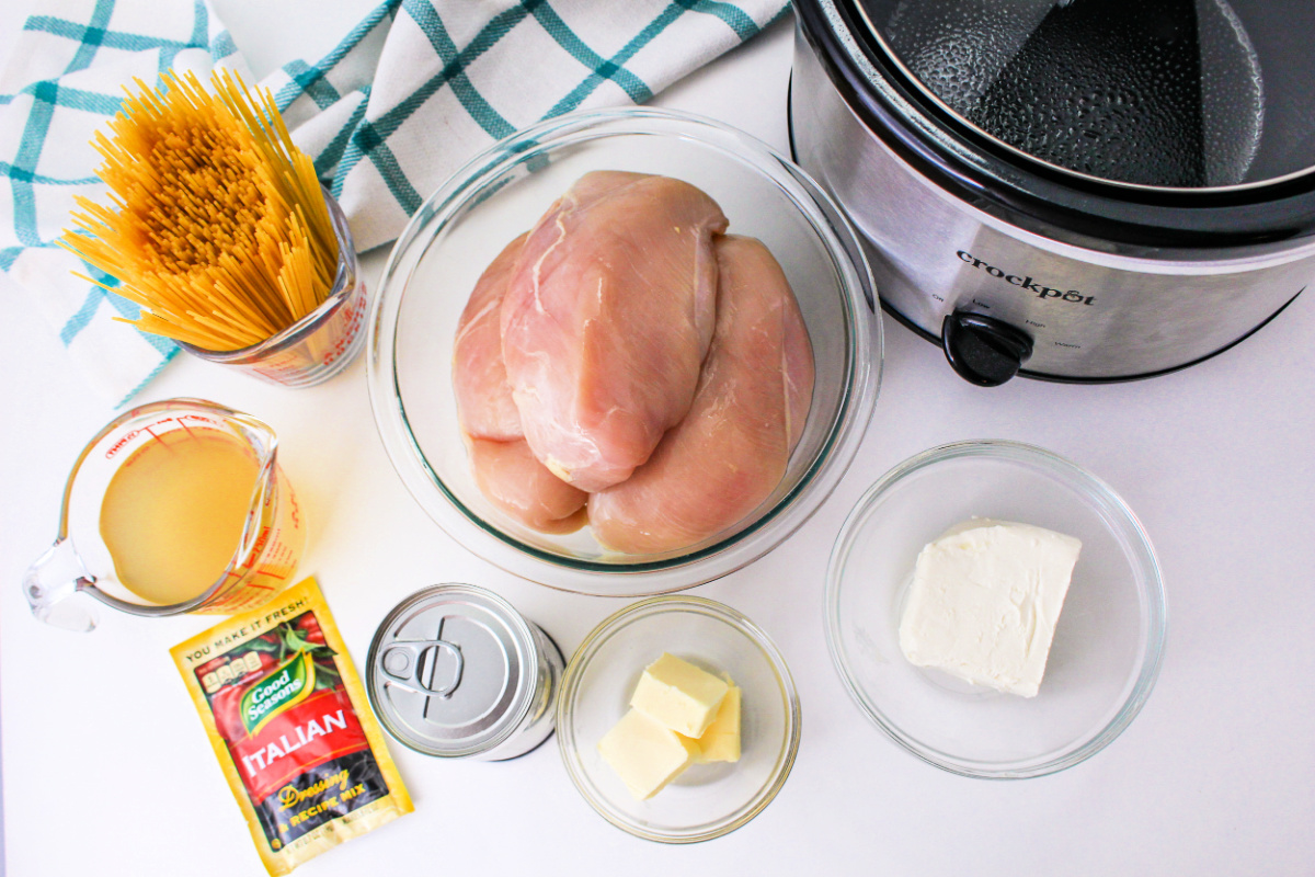 Slow Cooker Angel Chicken Ingredients including pasta, chicken stock, and butter.