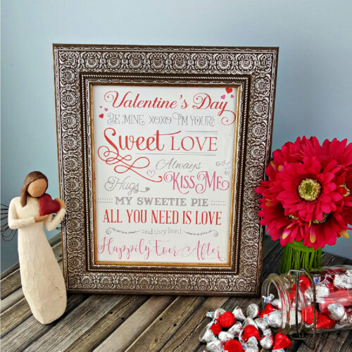 Framed Valentines Day Subway Art Printable next to holiday decor.