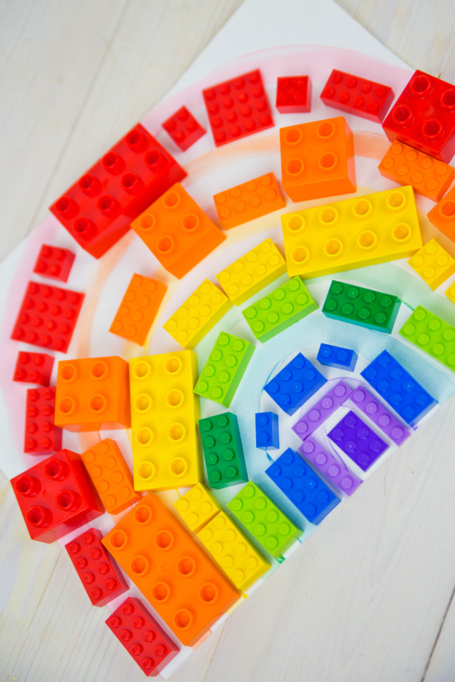 LEGOS in the shape of a rainbow.