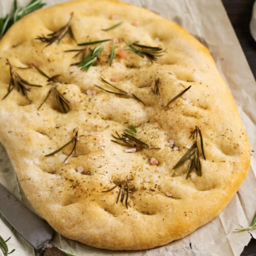 Rosemary Focaccia Bread on parchment paper.