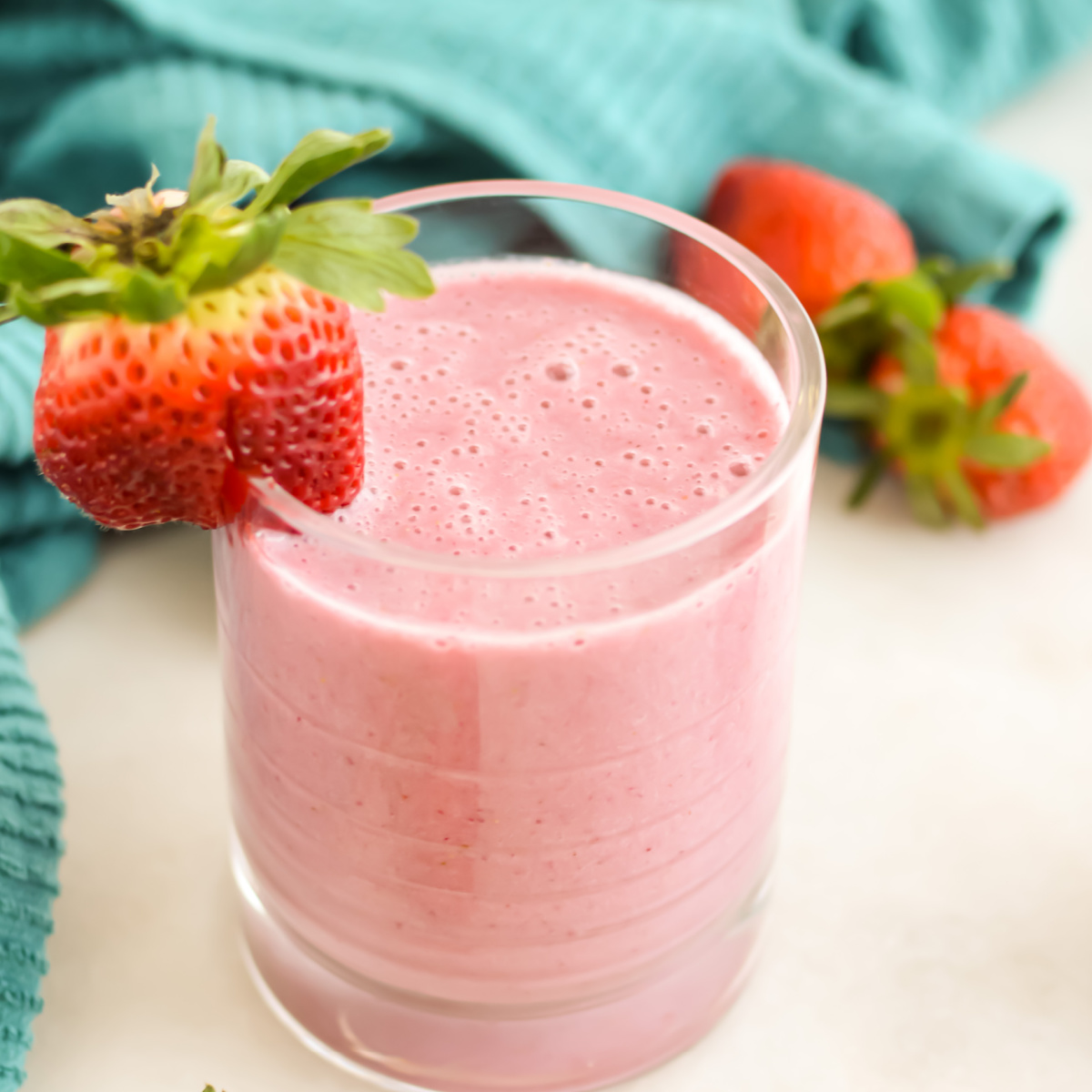 Close up of Strawberry Banana Smoothie in a small glass.