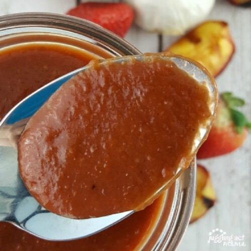 Close up of Strawberry Peach BBQ Sauce on a spoon.