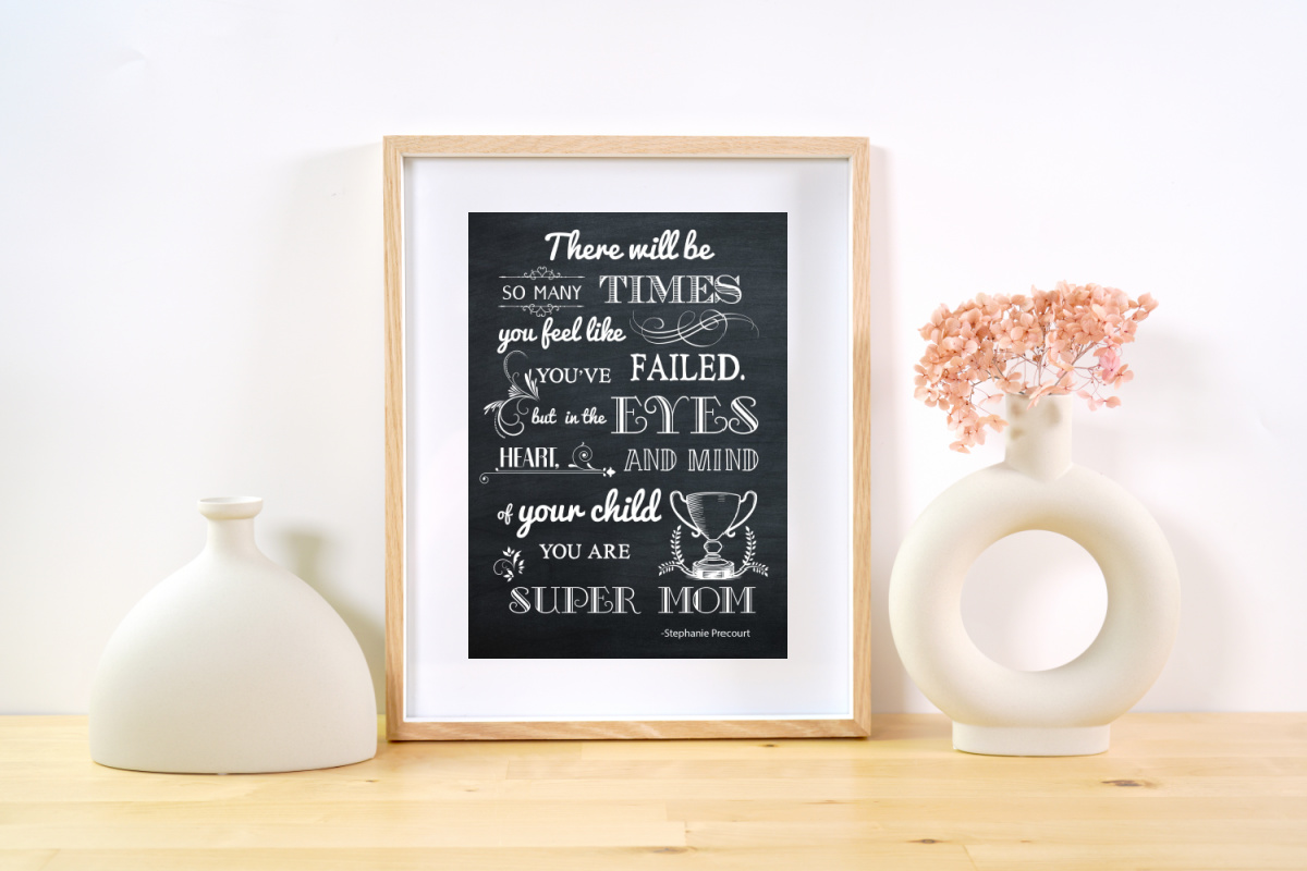 Mother's Day Chalkboard Printable on a shelf next to two vases.