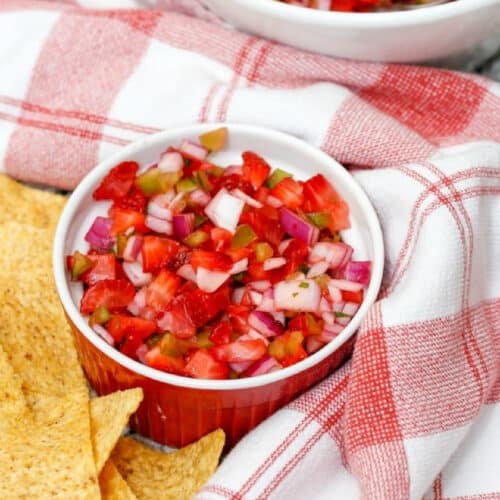 Strawberry Salsa with red onions and jalapeno in a small bowl.
