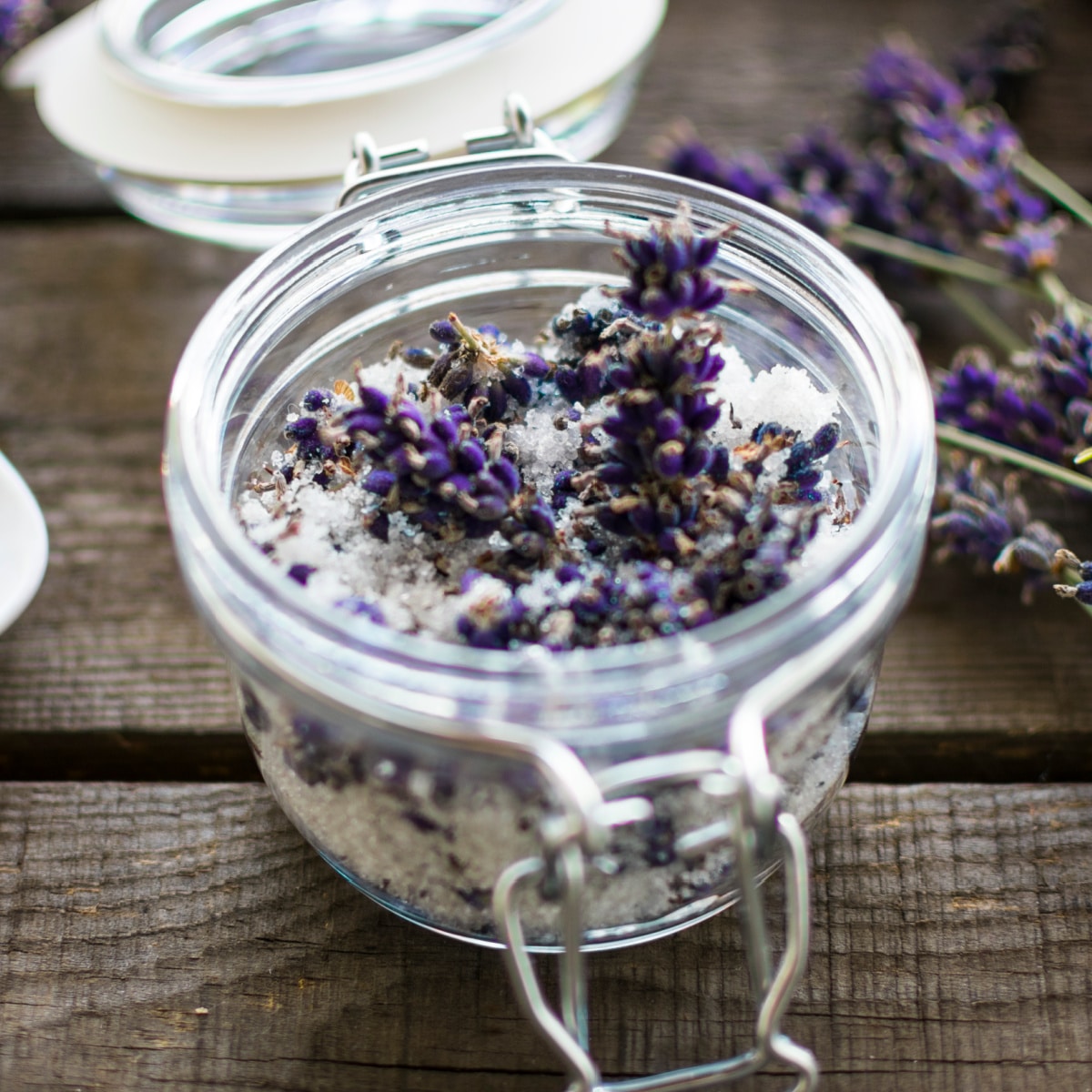 Small jar of bath salts with lavender buds.