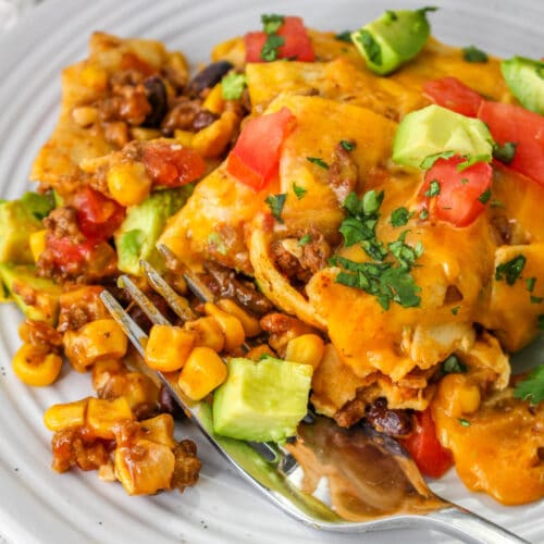 Cheesy Slow Cooker Mexican Casserole on a plate with a fork.
