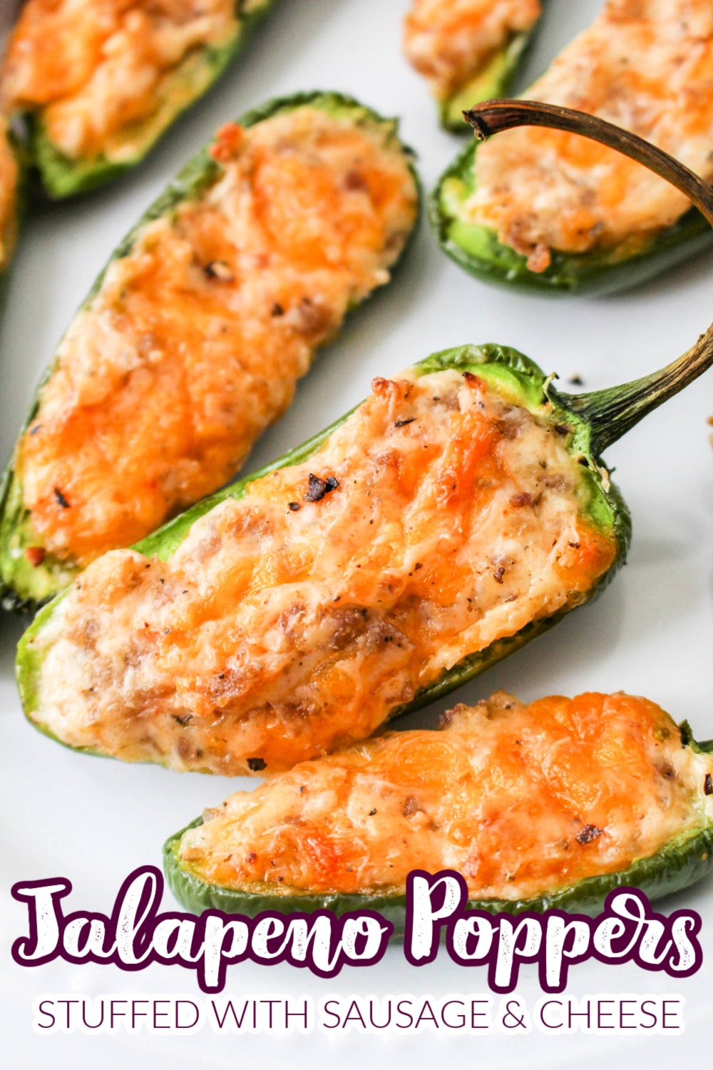 Sausage Stuffed Jalapenos - The delicious combination of spicy, jalapeño peppers, tangy cream cheese, salty ground sausage, and gooey cheddar cheese makes these jalapeno poppers one of my go-to appetizers for game day! via @jugglingactmama
